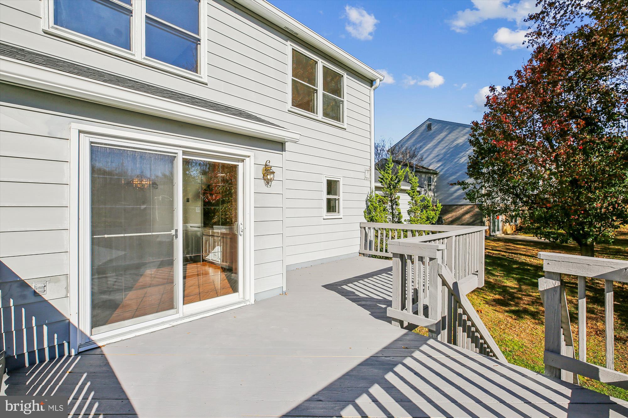 17 Locustwood Court Silver Spring, MD 20905 - Photo 62 of 72 a view of a patio with table and chairs and wooden floor