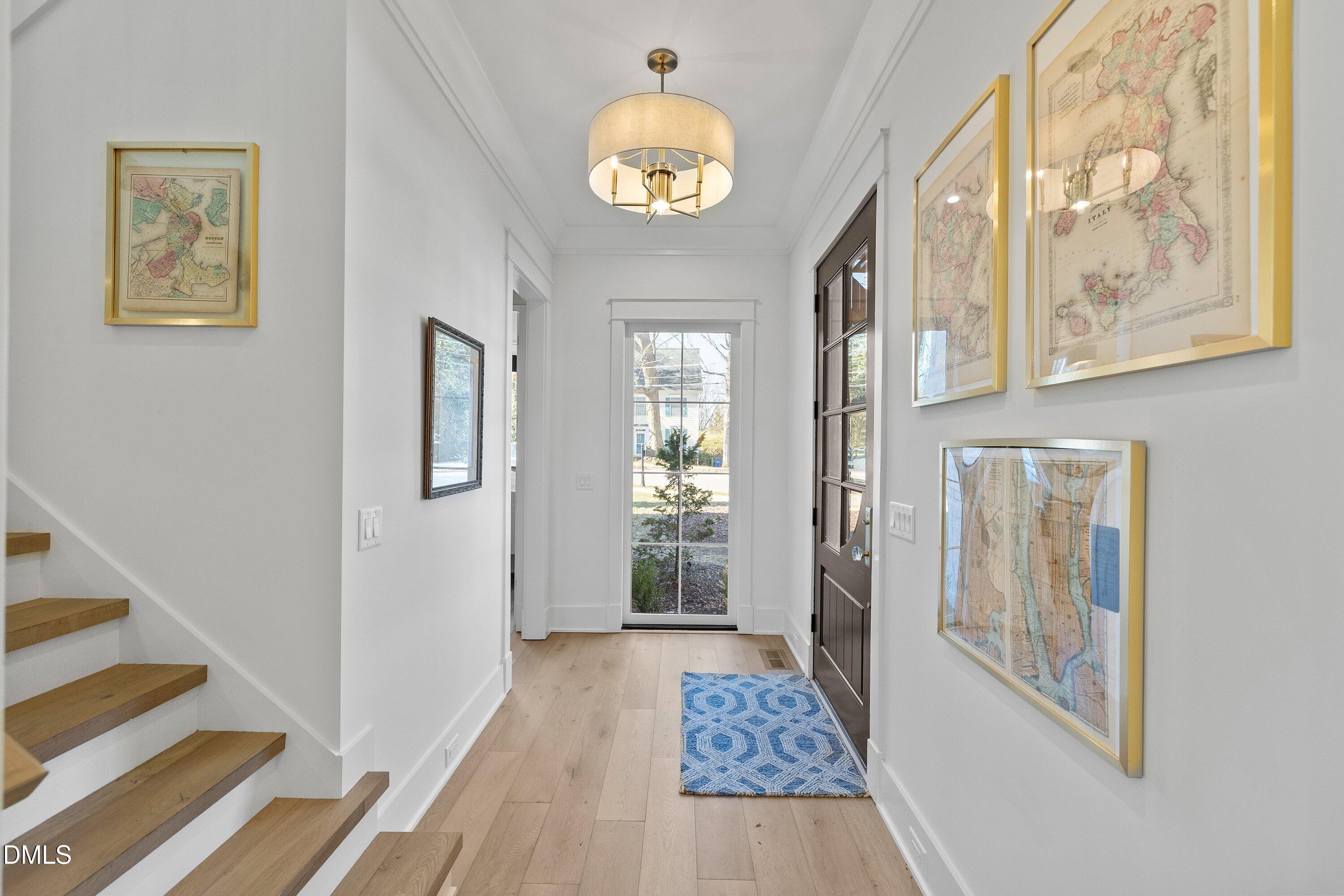 906 Brooks Avenue Raleigh, NC 27607 - Photo 10 of 64 a view of an entryway with wooden floor