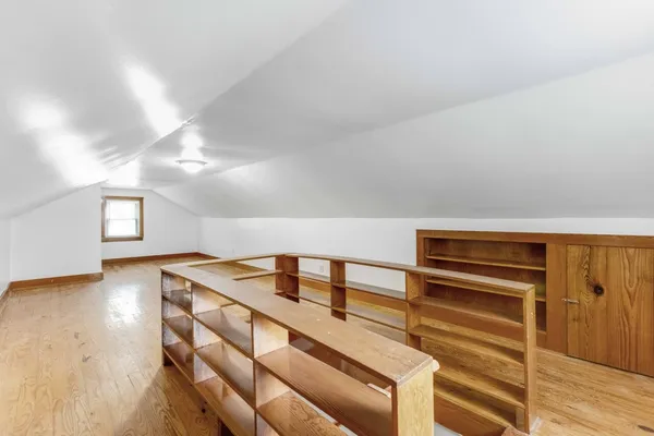 a view of room with wooden floor