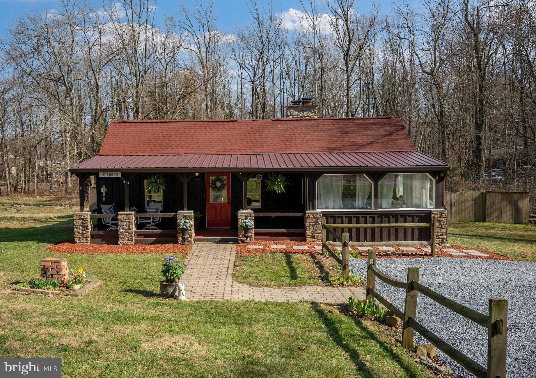 13403 Catoctin Furnace Road Thurmont, MD 21788 - Photo 1 of 60 a front view of a house with garden and sitting area