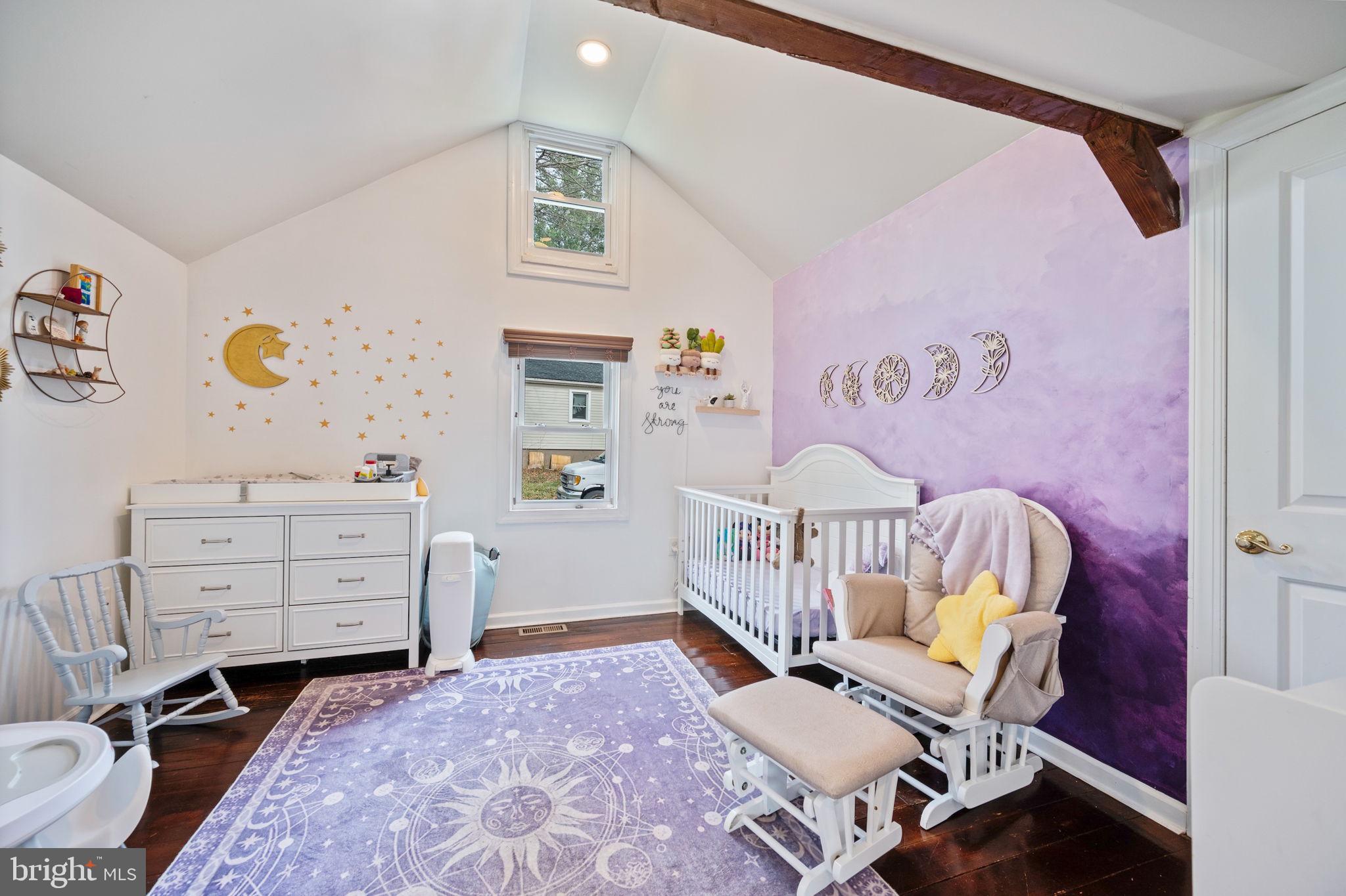 13403 Catoctin Furnace Road Thurmont, MD 21788 - Photo 23 of 60 a bedroom with a baby bed a couch and dresser