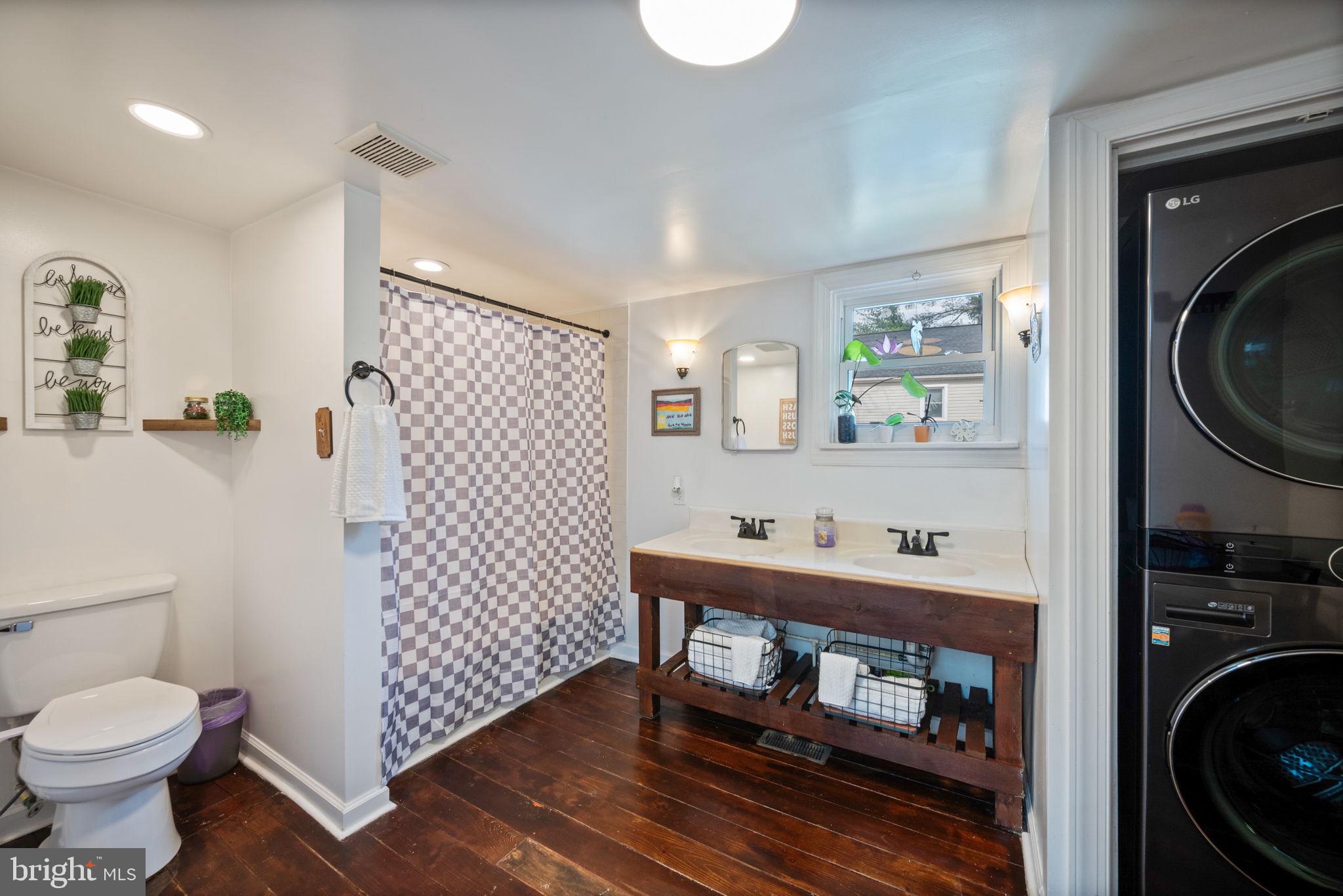 13403 Catoctin Furnace Road Thurmont, MD 21788 - Photo 27 of 60 a bathroom with a sink toilet and shower