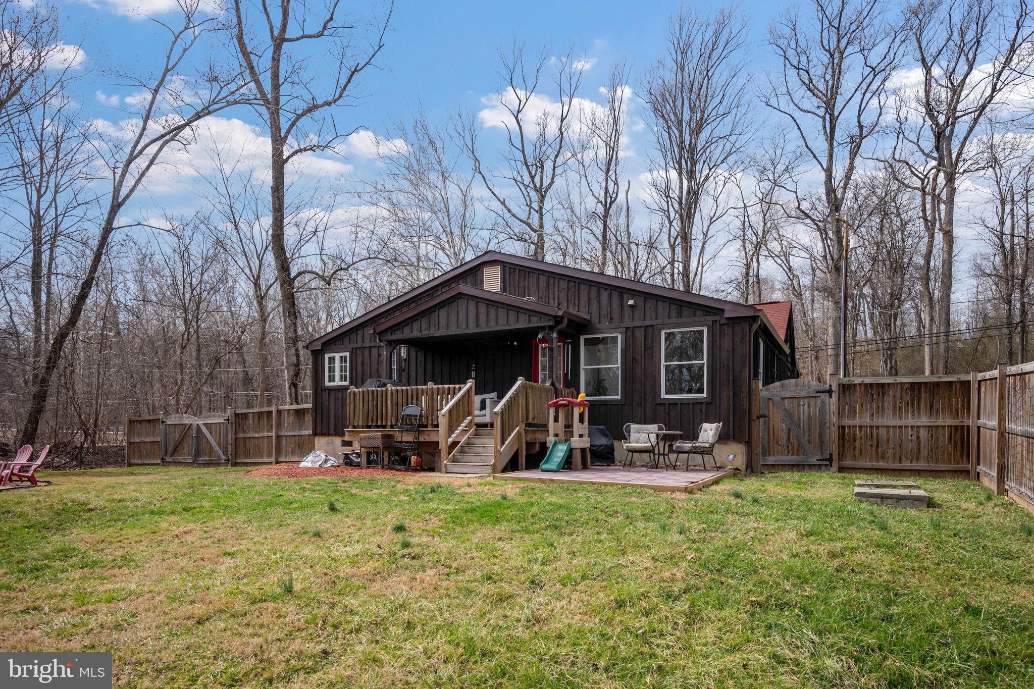13403 Catoctin Furnace Road Thurmont, MD 21788 - Photo 42 of 60 a view of a house with backyard and a tree