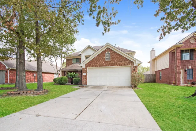 a front view of a house with yard