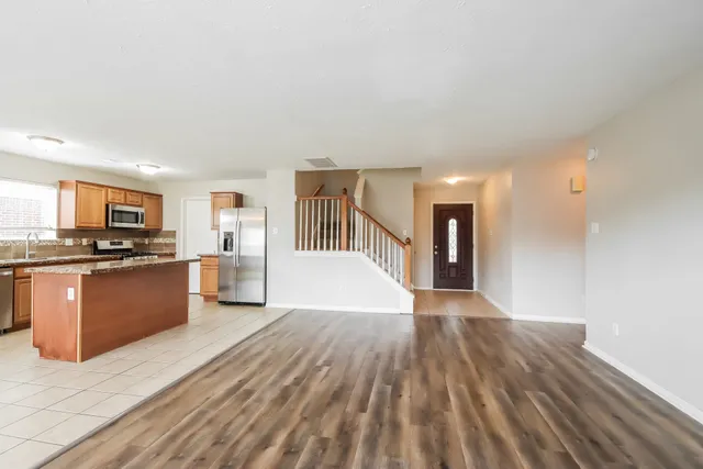 a view of kitchen with wooden floor