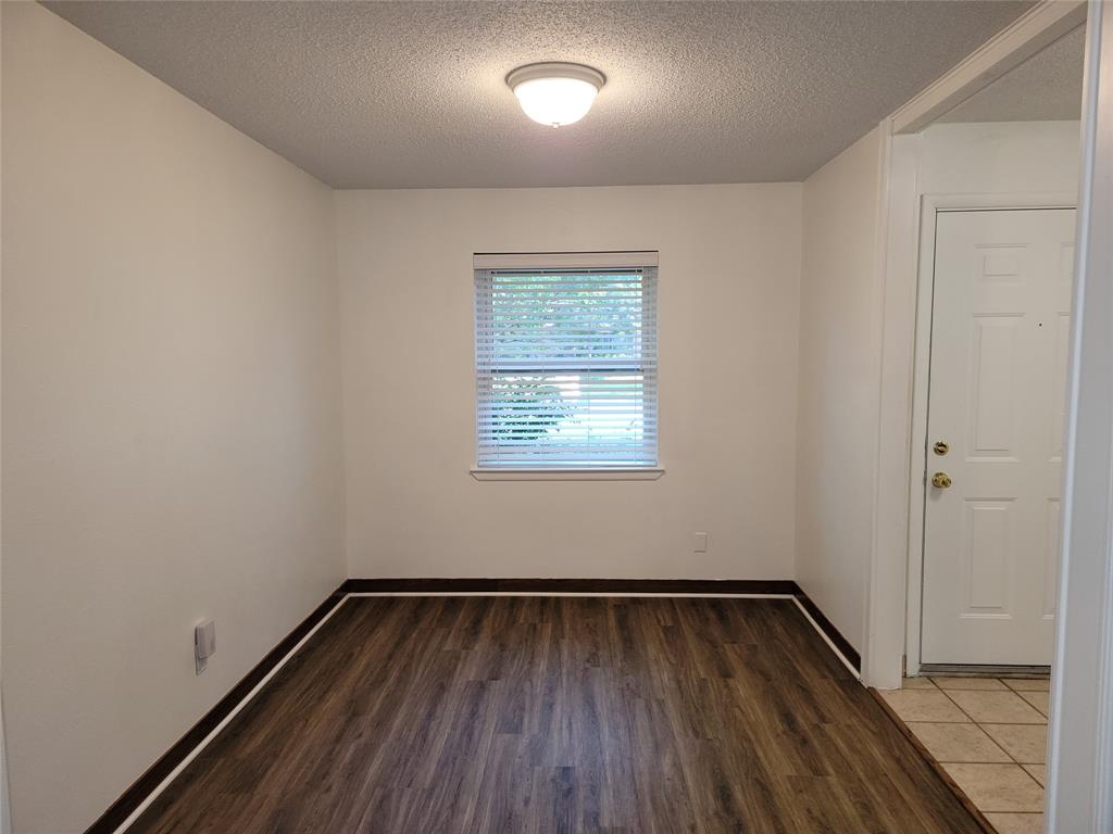 1000 Springdale Road Bedford, TX 76021 - Photo 11 of 36 Flexible formal dining space near the front door could also be repurposed as an office or to meet your needs.