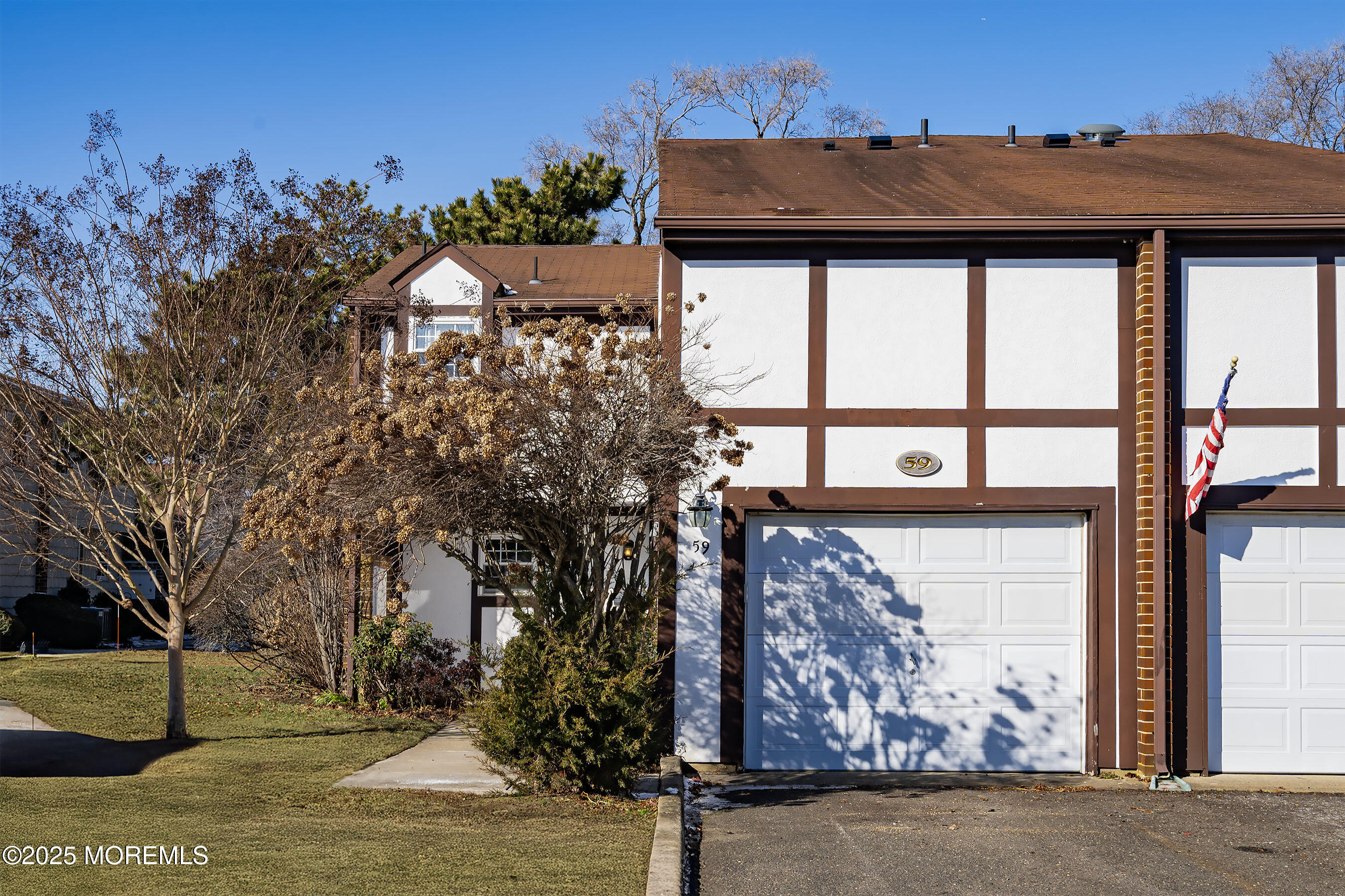 59 Walnut Drive Spring Lake Heights, NJ 07762 - Photo 1 of 59 a front view of a house with garden