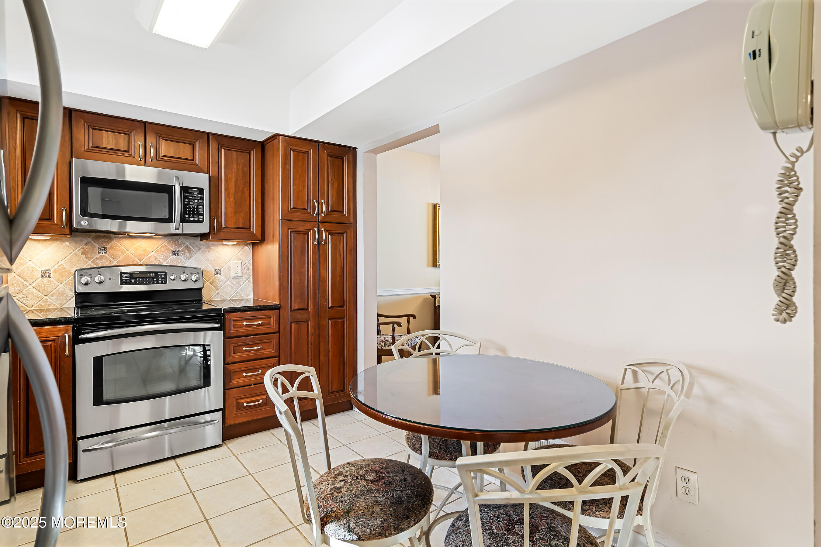 59 Walnut Drive Spring Lake Heights, NJ 07762 - Photo 11 of 59 a table and chairs in a kitchen