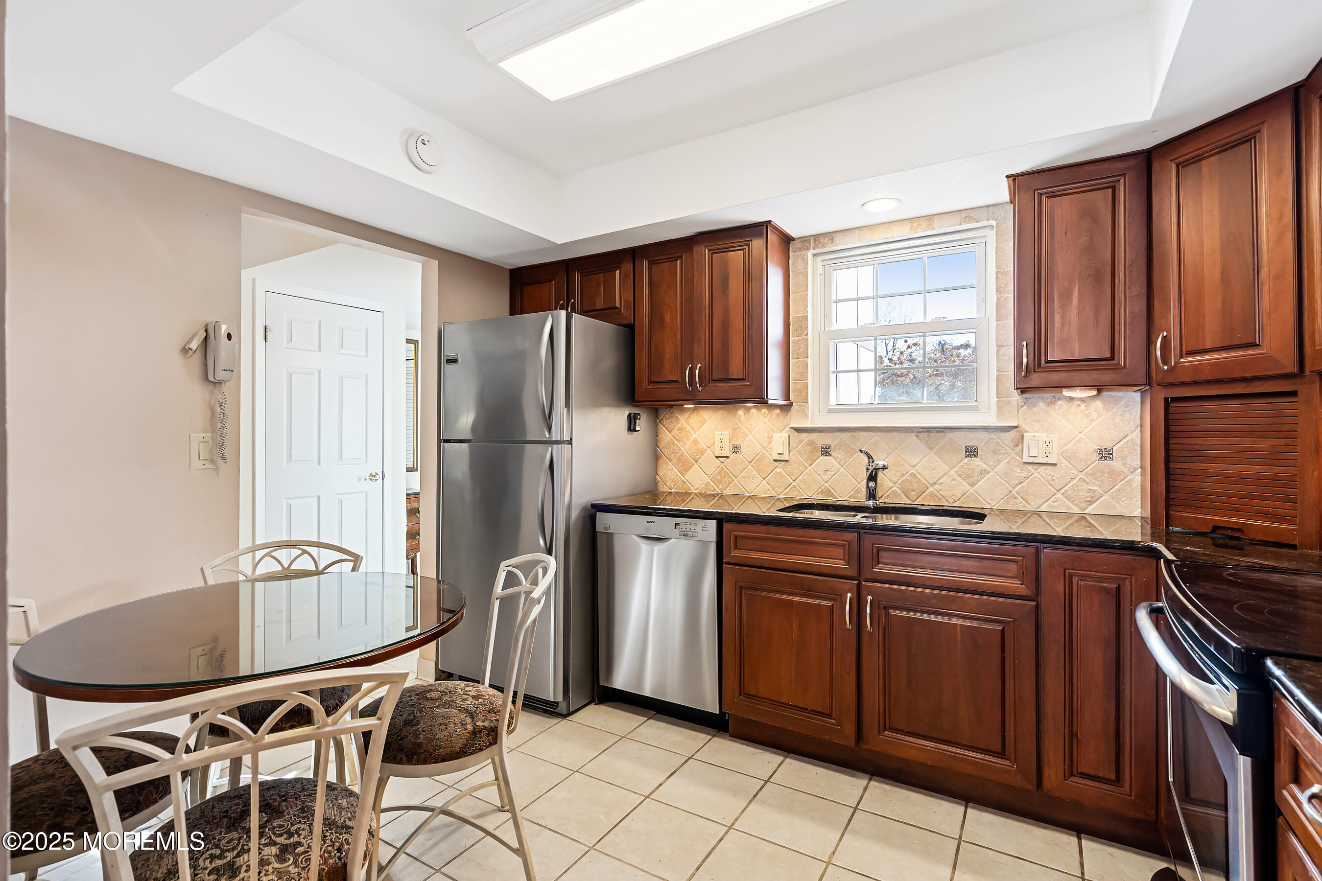 59 Walnut Drive Spring Lake Heights, NJ 07762 - Photo 13 of 59 a kitchen with stainless steel appliances granite countertop a refrigerator and a sink