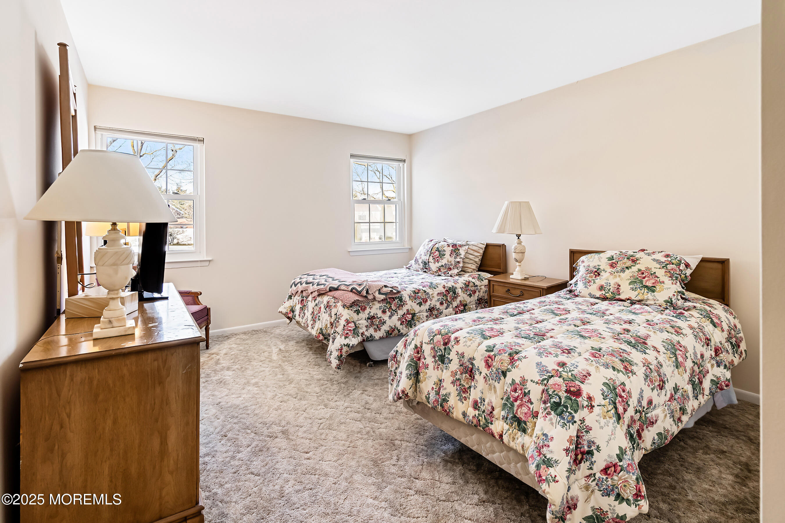 59 Walnut Drive Spring Lake Heights, NJ 07762 - Photo 17 of 59 a bedroom with two beds and a lamp