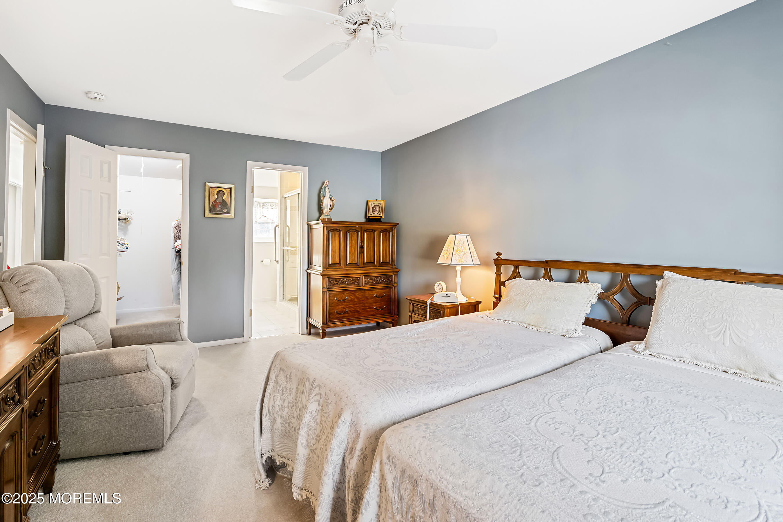 59 Walnut Drive Spring Lake Heights, NJ 07762 - Photo 20 of 59 a bedroom with a bed and a chandelier