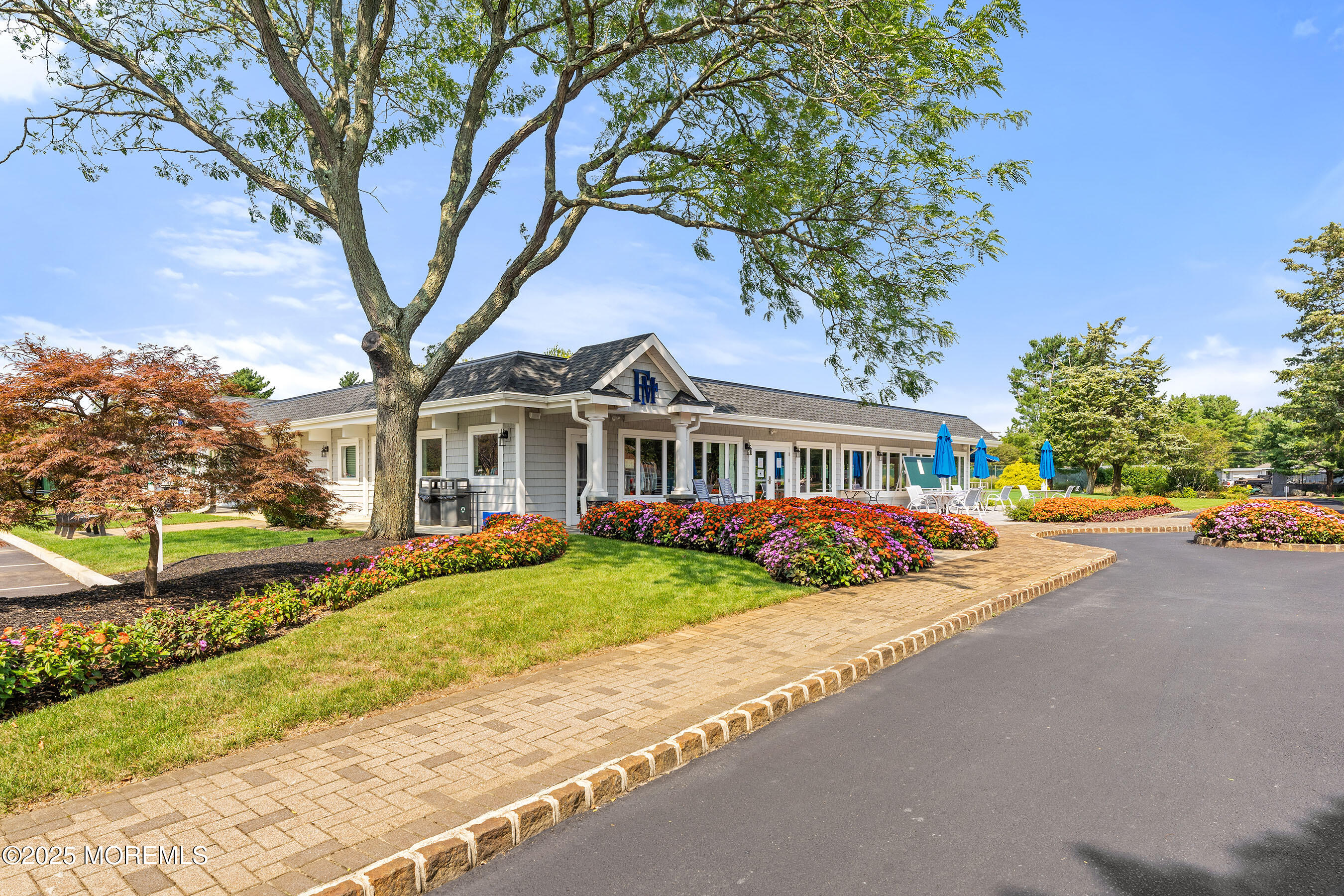 59 Walnut Drive Spring Lake Heights, NJ 07762 - Photo 43 of 59 a front view of a house with a garden and trees
