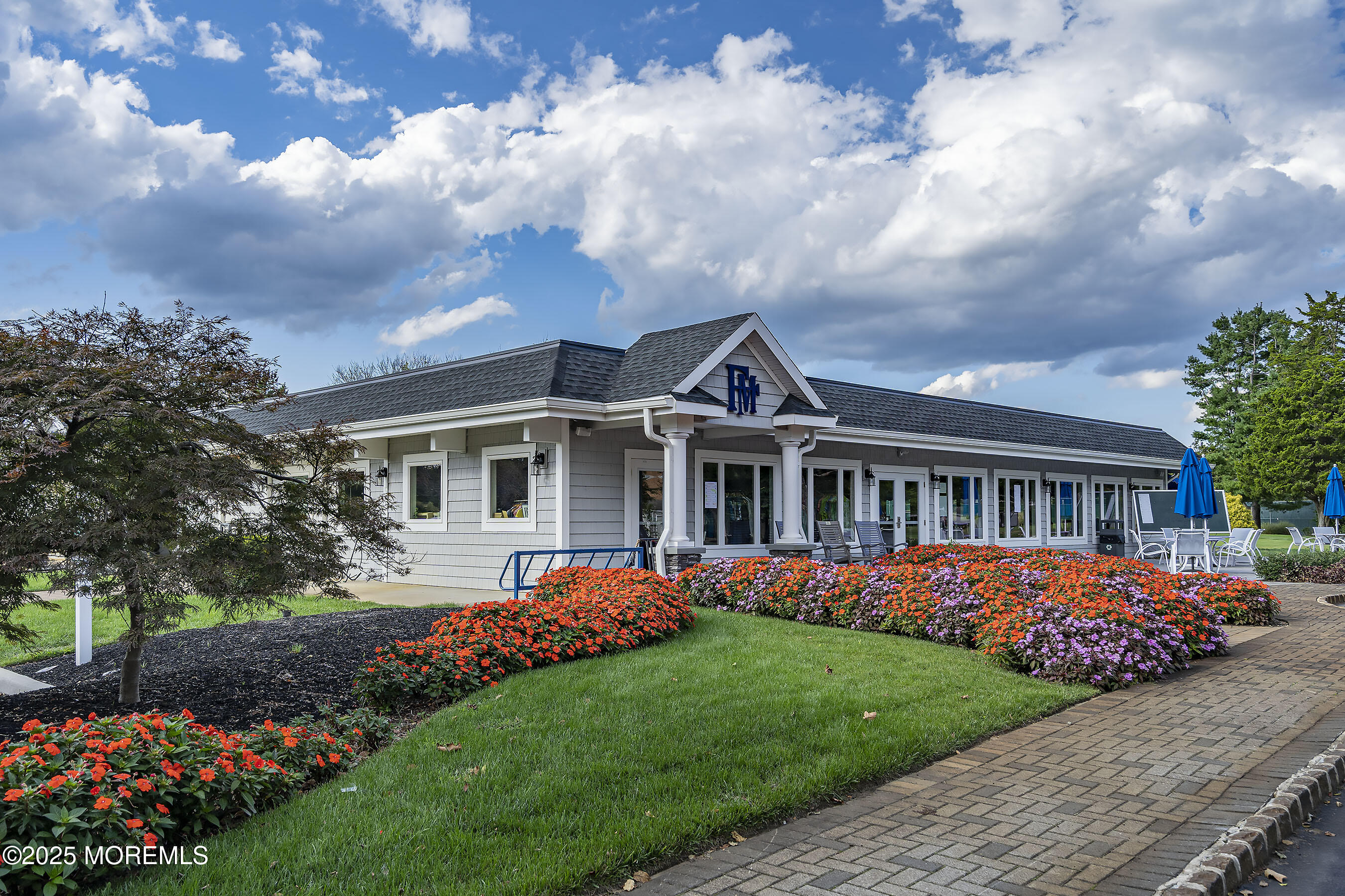 59 Walnut Drive Spring Lake Heights, NJ 07762 - Photo 44 of 59 a front view of a house with a garden and trees