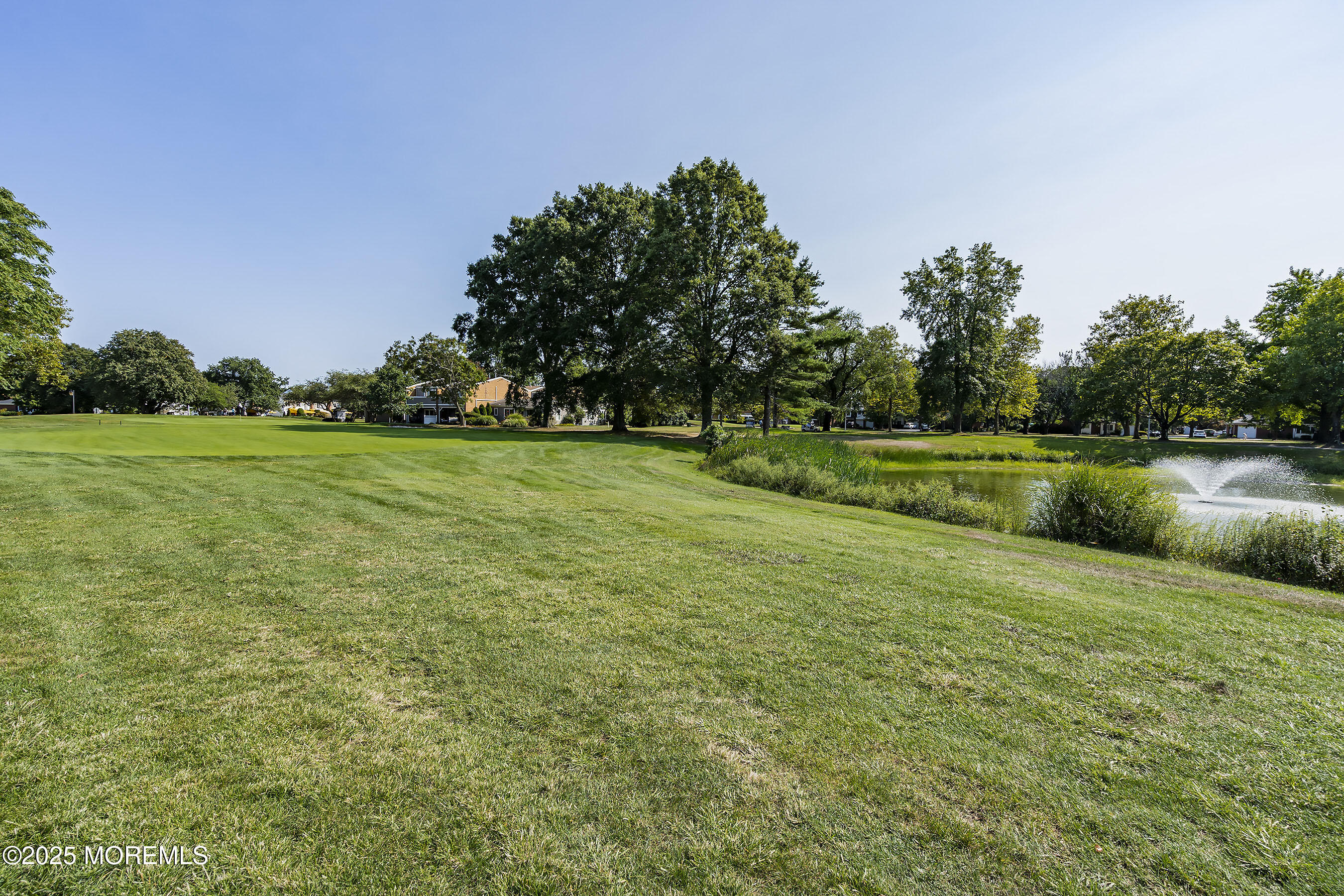 59 Walnut Drive Spring Lake Heights, NJ 07762 - Photo 51 of 59 a view of a golf course with a lake