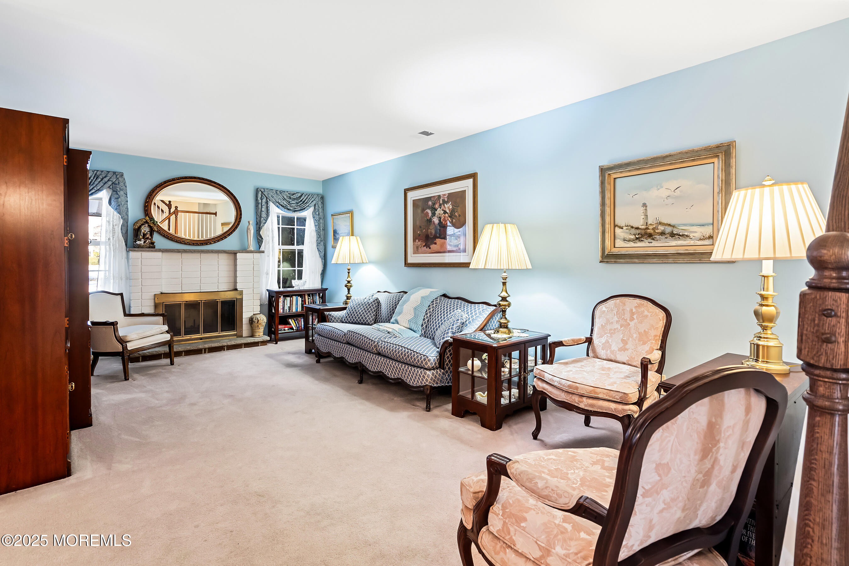 59 Walnut Drive Spring Lake Heights, NJ 07762 - Photo 6 of 59 a living room with furniture a rug and a fireplace