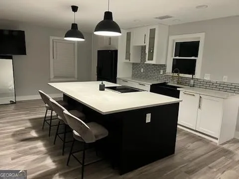 a kitchen that has a sink and a stove in it
