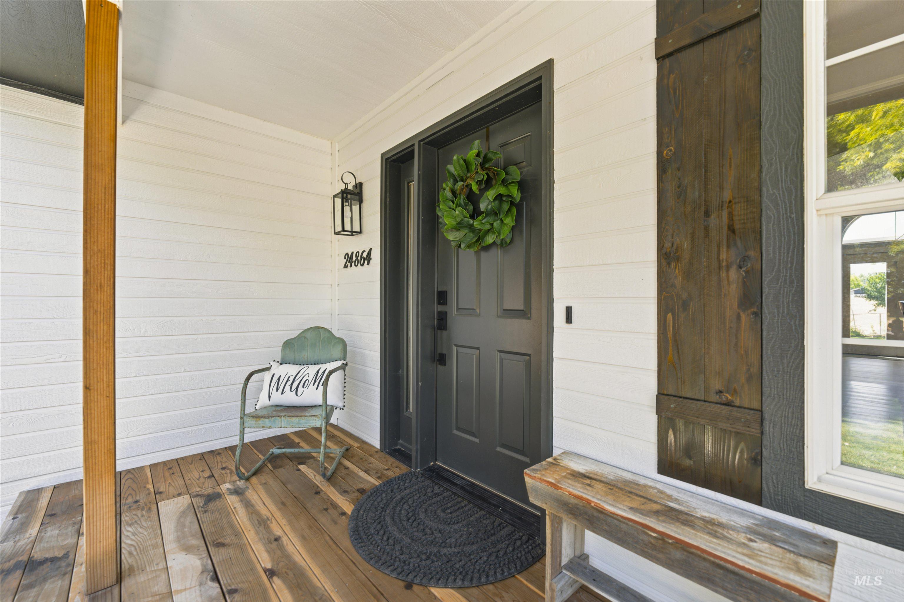 24864 Coventry Drive Caldwell, ID 83607 - Photo 5 of 49 Covered front porch featuring wood-finish flooring