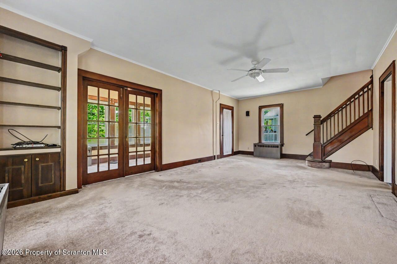 502 Layton Road Clarks Summit, PA 18411 - Photo 10 of 42 a view of an empty room with a fireplace and a window