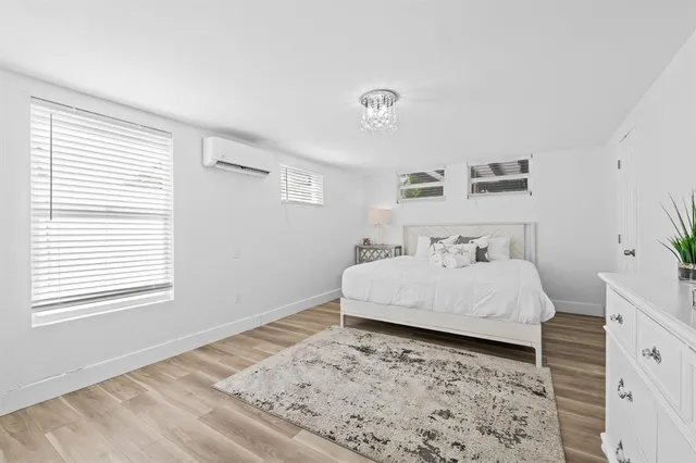 a bathroom with a bathtub a shower a sink and mirror