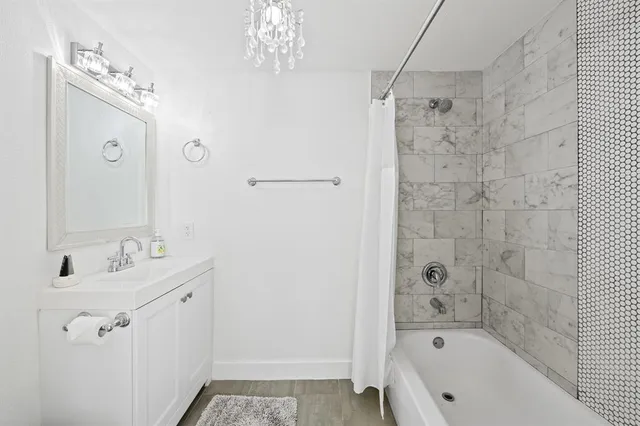 a bedroom with a bed and a potted plant