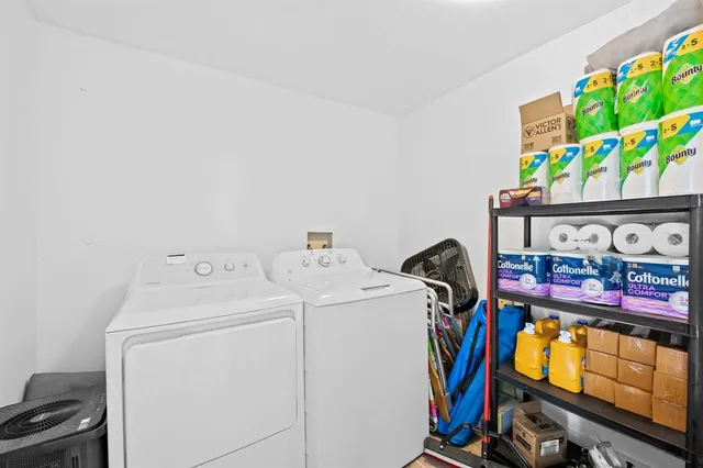 a view of stairs and flowers with yard in front of it