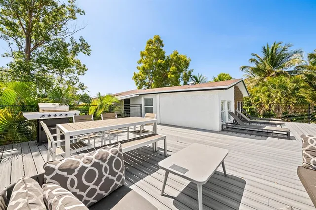 a kitchen with stainless steel appliances a refrigerator sink and stove
