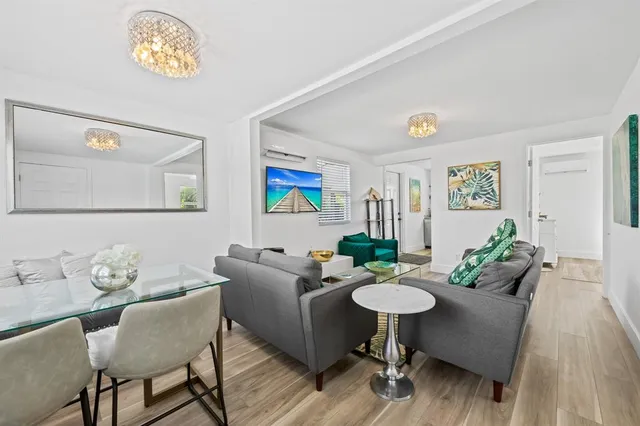 a bathroom with a shower sink vanity mirror and toilet
