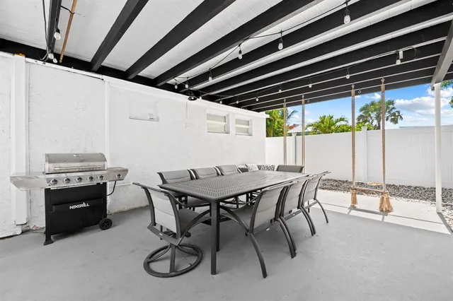 a large kitchen with granite countertop a sink and dishwasher stove top oven