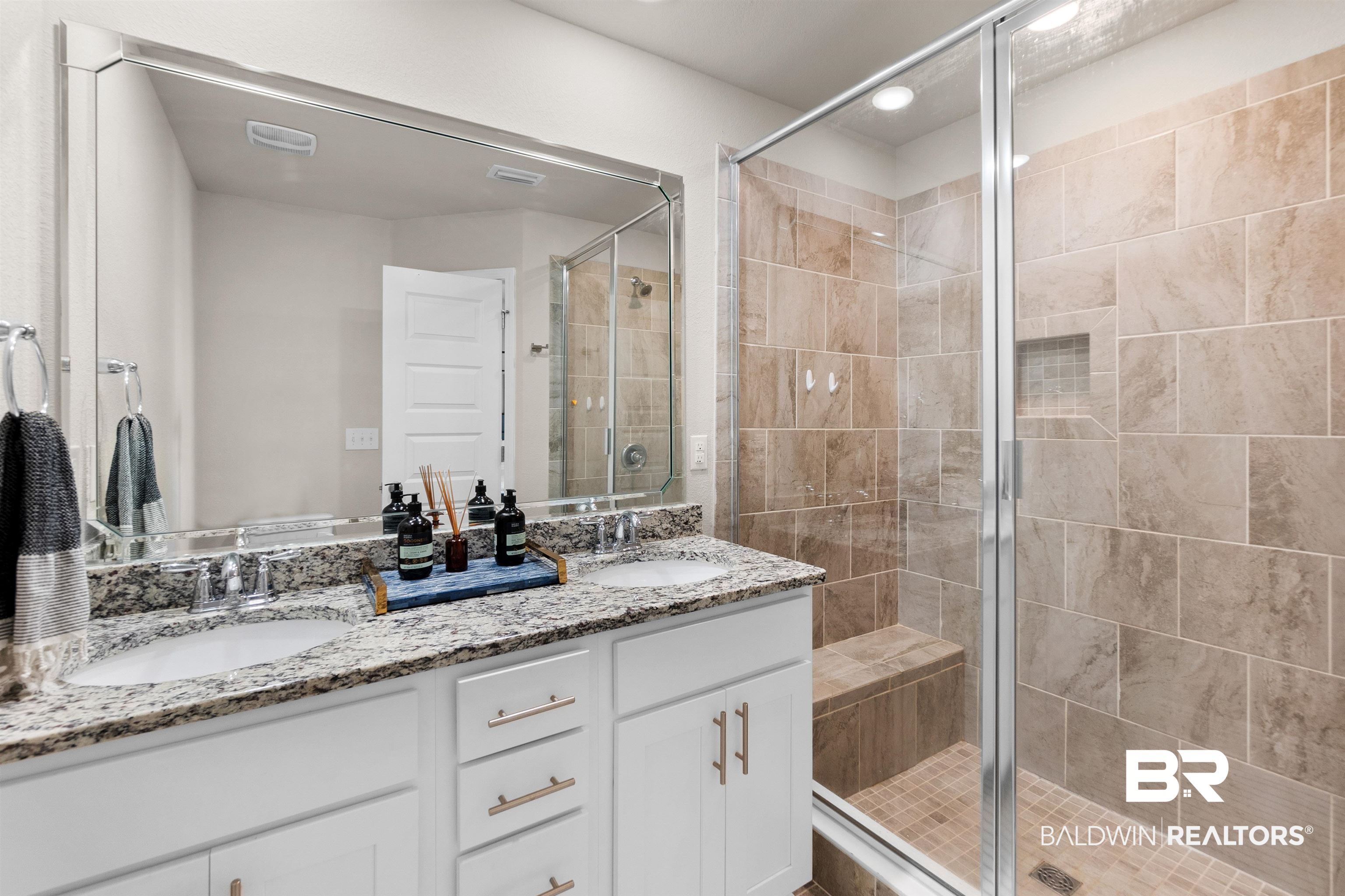 23975 Cottage Loop Orange Beach, AL 36561 - Photo 9 of 23 Bathroom with dual bowl vanity and an enclosed shower