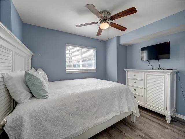 a kitchen with granite countertop white cabinets white stainless steel appliances and sink