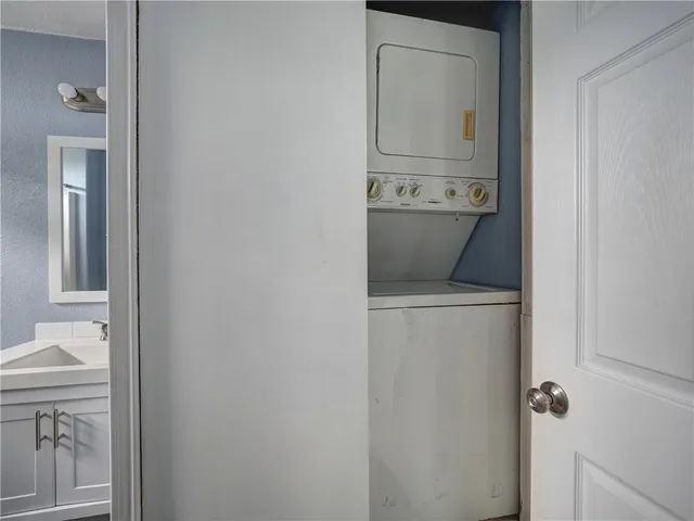 a view of an empty room and a window