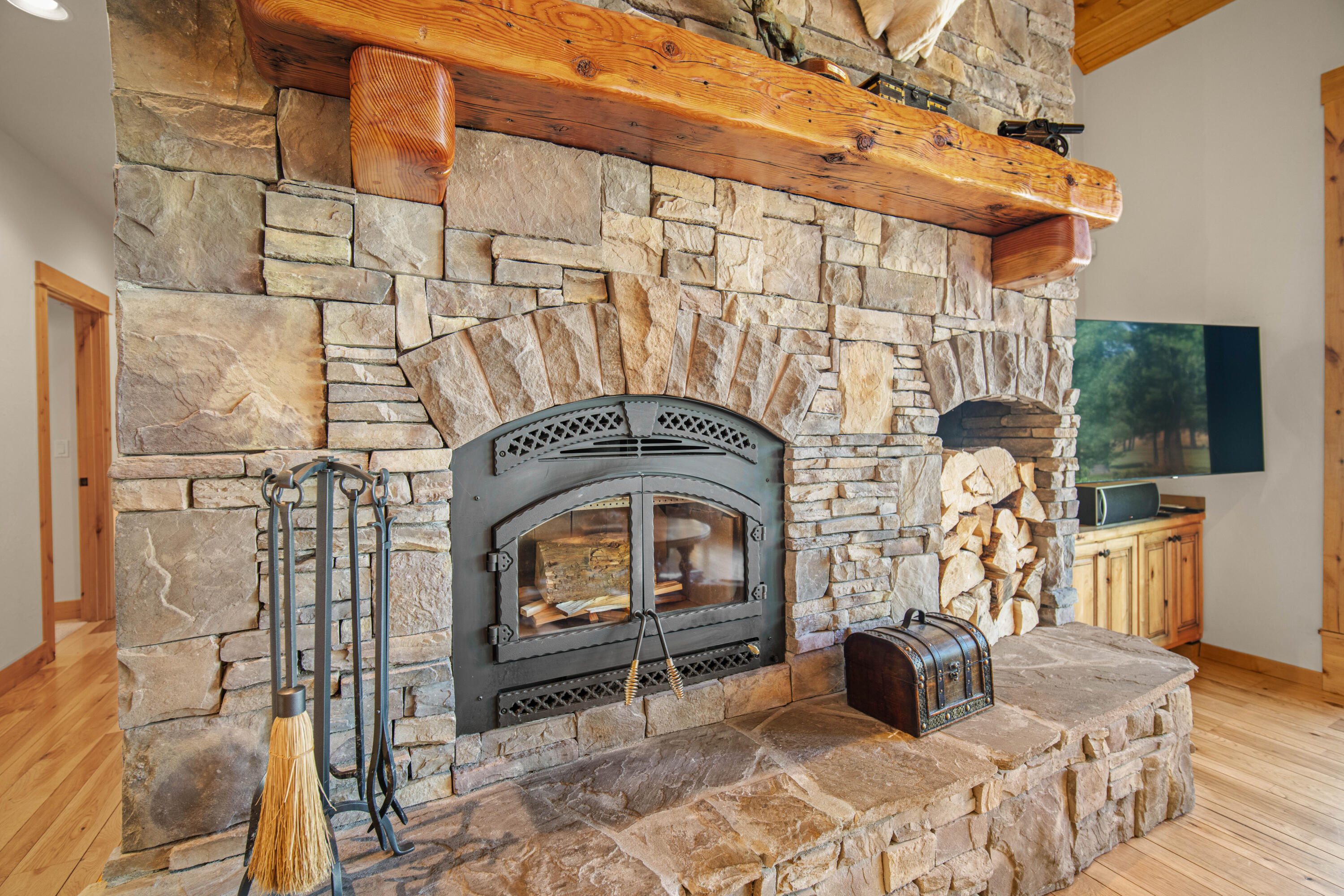 56689 Dancing Rock Loop Bend, OR 97707 - Photo 7 of 51 a living room with furniture a flat screen tv and a fireplace