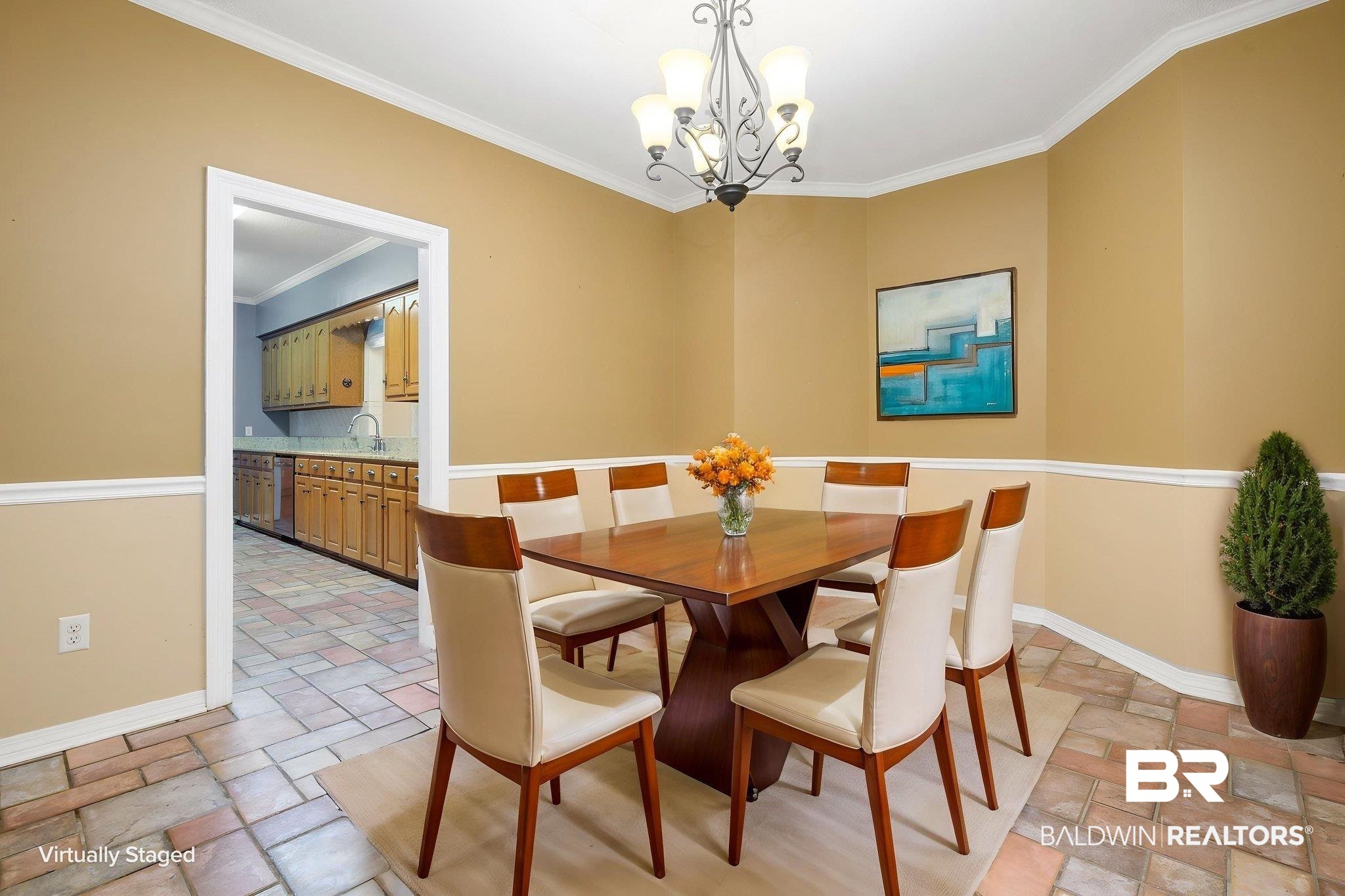 7540 2 Mile Road Irvington, AL 36544 - Photo 6 of 82 Dining area featuring neutral-toned walls with wainscoting, a ceiling-mounted chandelier, and tile flooring