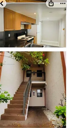 a view of kitchen with stainless steel appliances kitchen island a stove and a sink