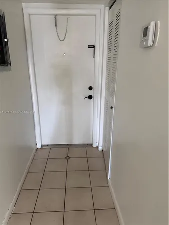 a bathroom with a granite countertop shower and a sink
