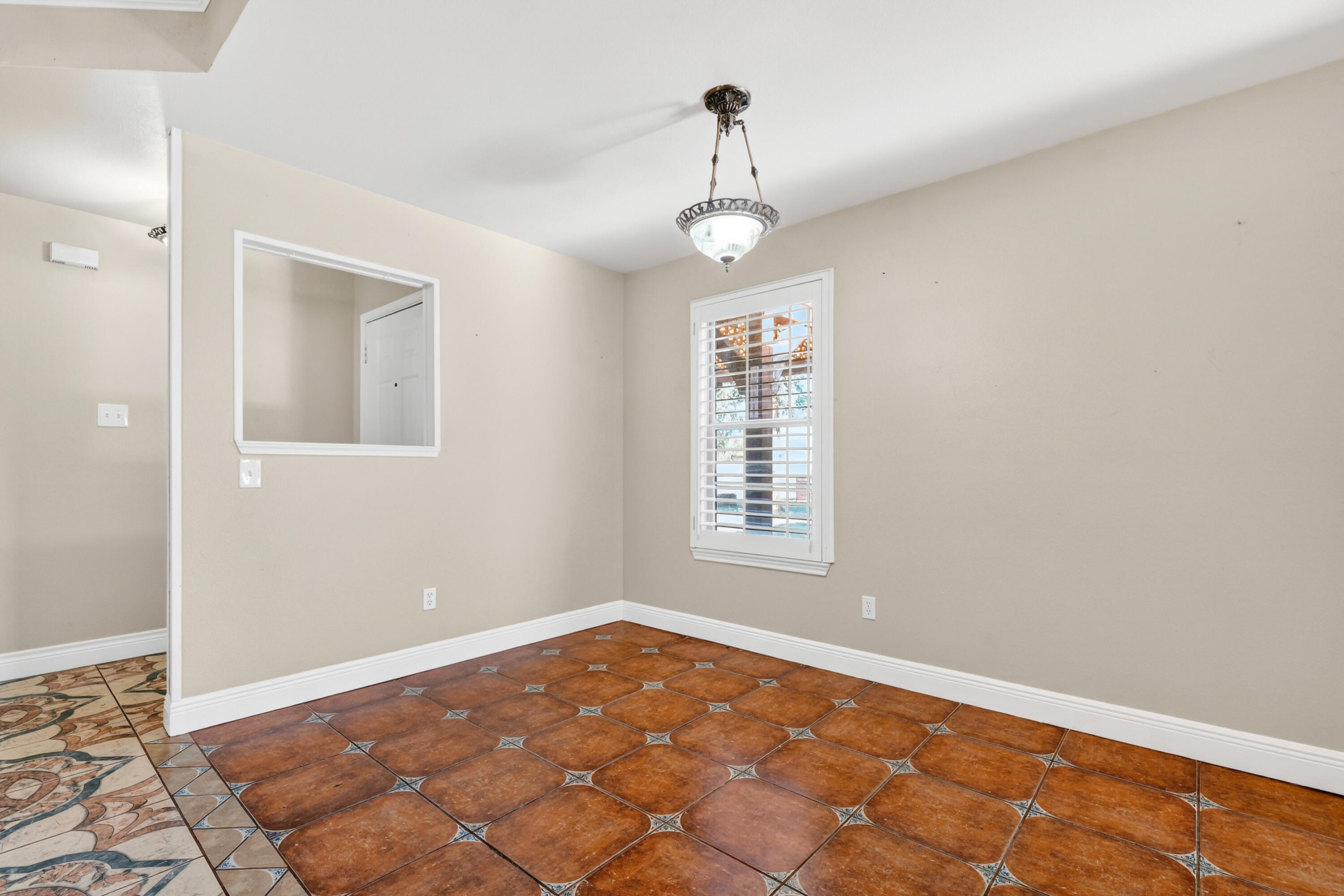 2415 93rd Street Lubbock, TX 79423 - Photo 8 of 24 a view of an empty room with a window