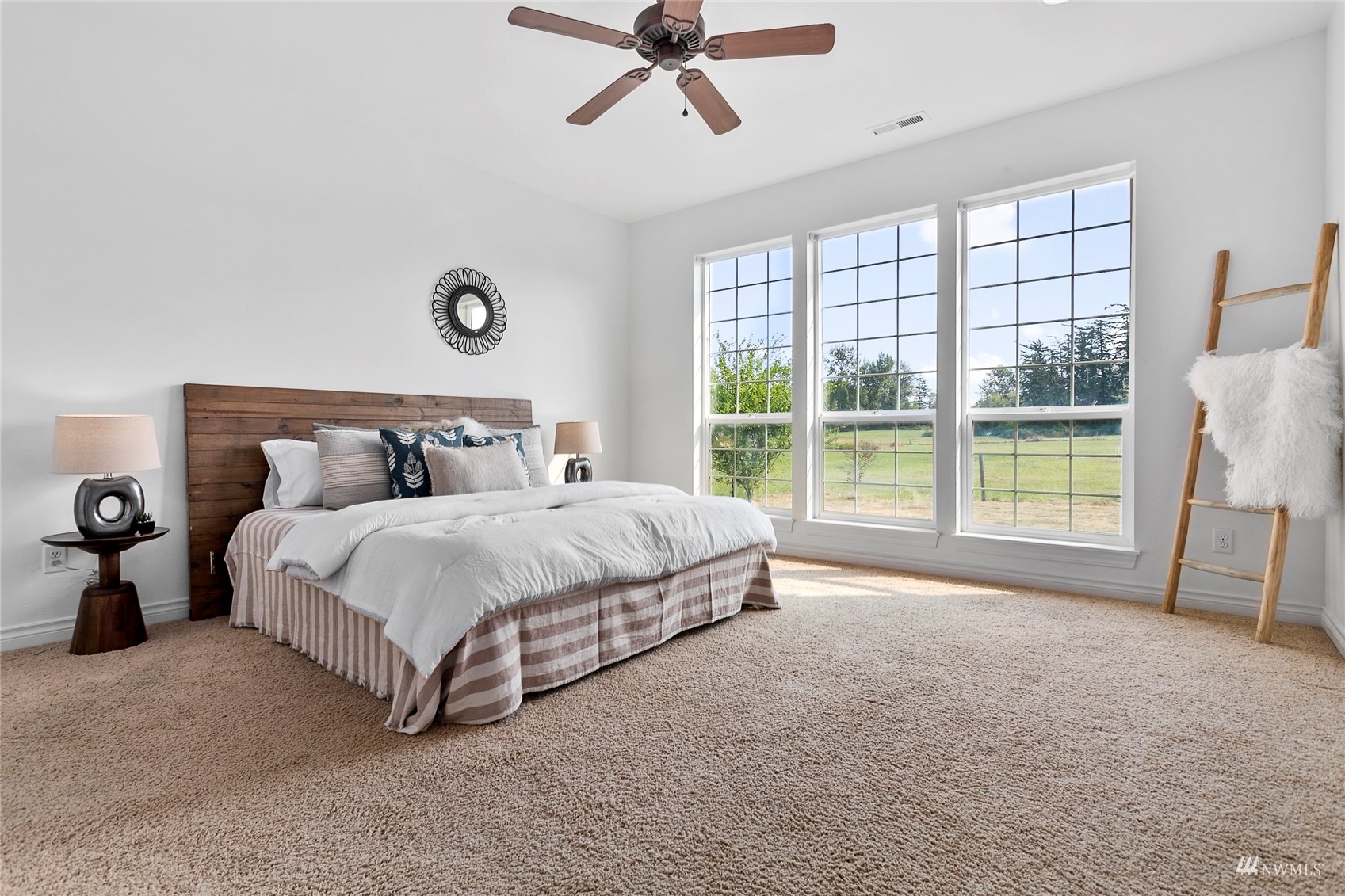 4906 Graveline Road Bellingham, WA 98226 - Photo 15 of 30 a spacious bedroom with a bed and a large window