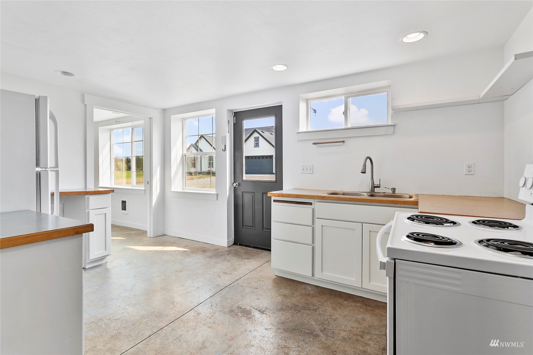 4906 Graveline Road Bellingham, WA 98226 - Photo 22 of 30 a kitchen with cabinets and window