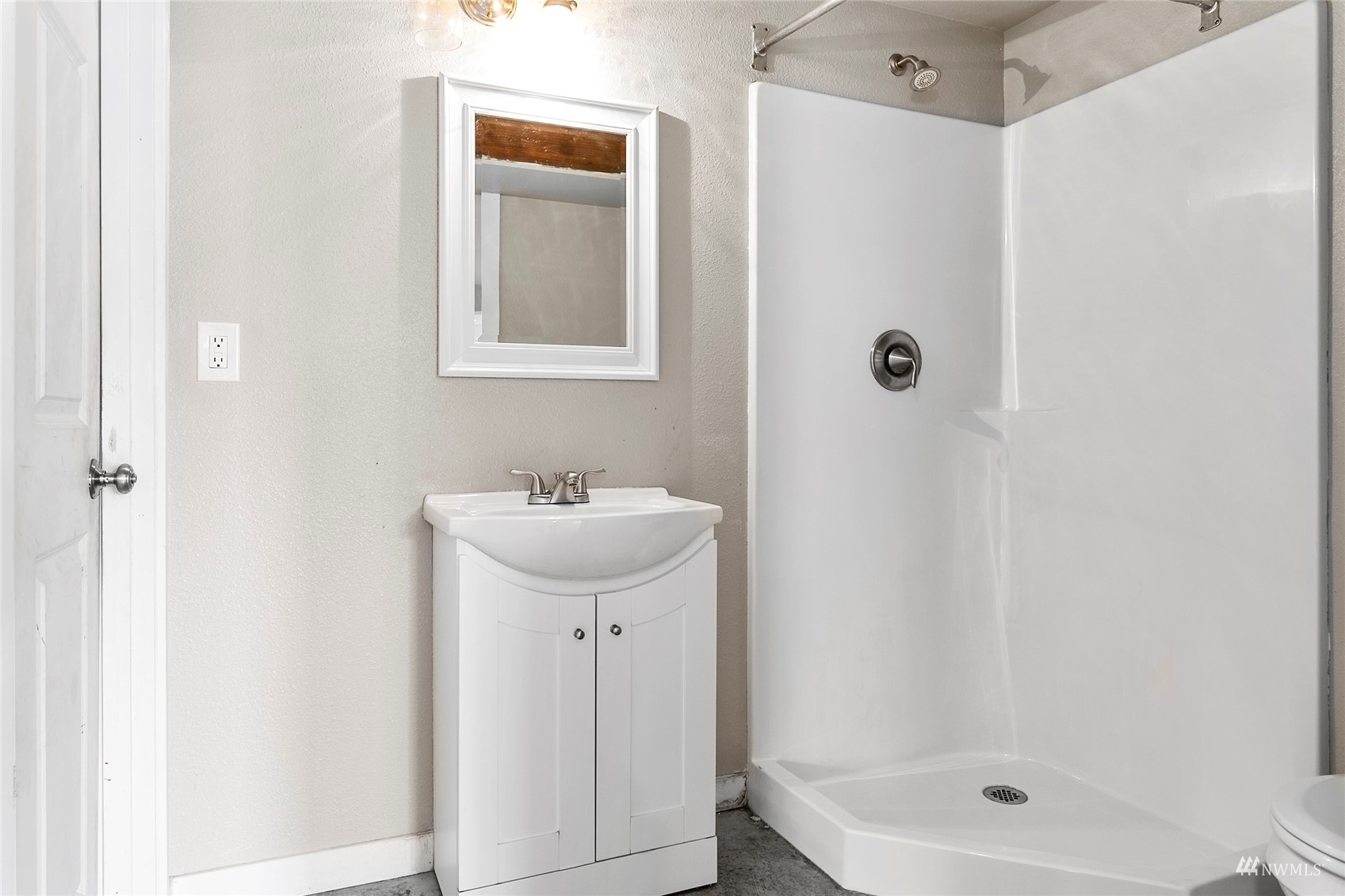 4906 Graveline Road Bellingham, WA 98226 - Photo 26 of 30 a bathroom with a sink a mirror and shower