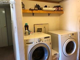 38120 Trogilo Road Rush, CO 80833 - Photo 11 of 16 a utility room with dryer and washer
