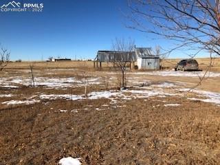 38120 Trogilo Road Rush, CO 80833 - Photo 6 of 16 a view of yard with car parked
