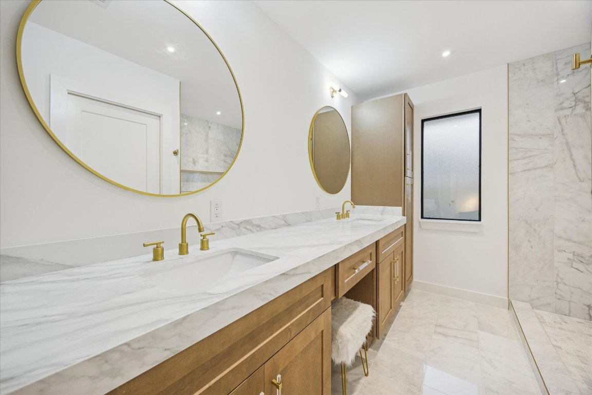 1611 Ridgehaven Drive Austin, TX 78723 - Photo 19 of 35 a bathroom with a sink mirror and vanity