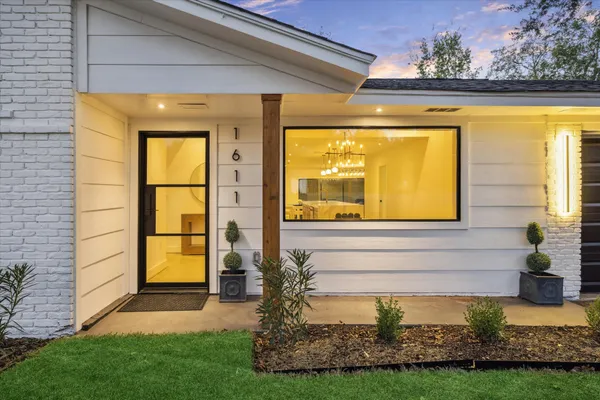 a view of house with a swimming pool