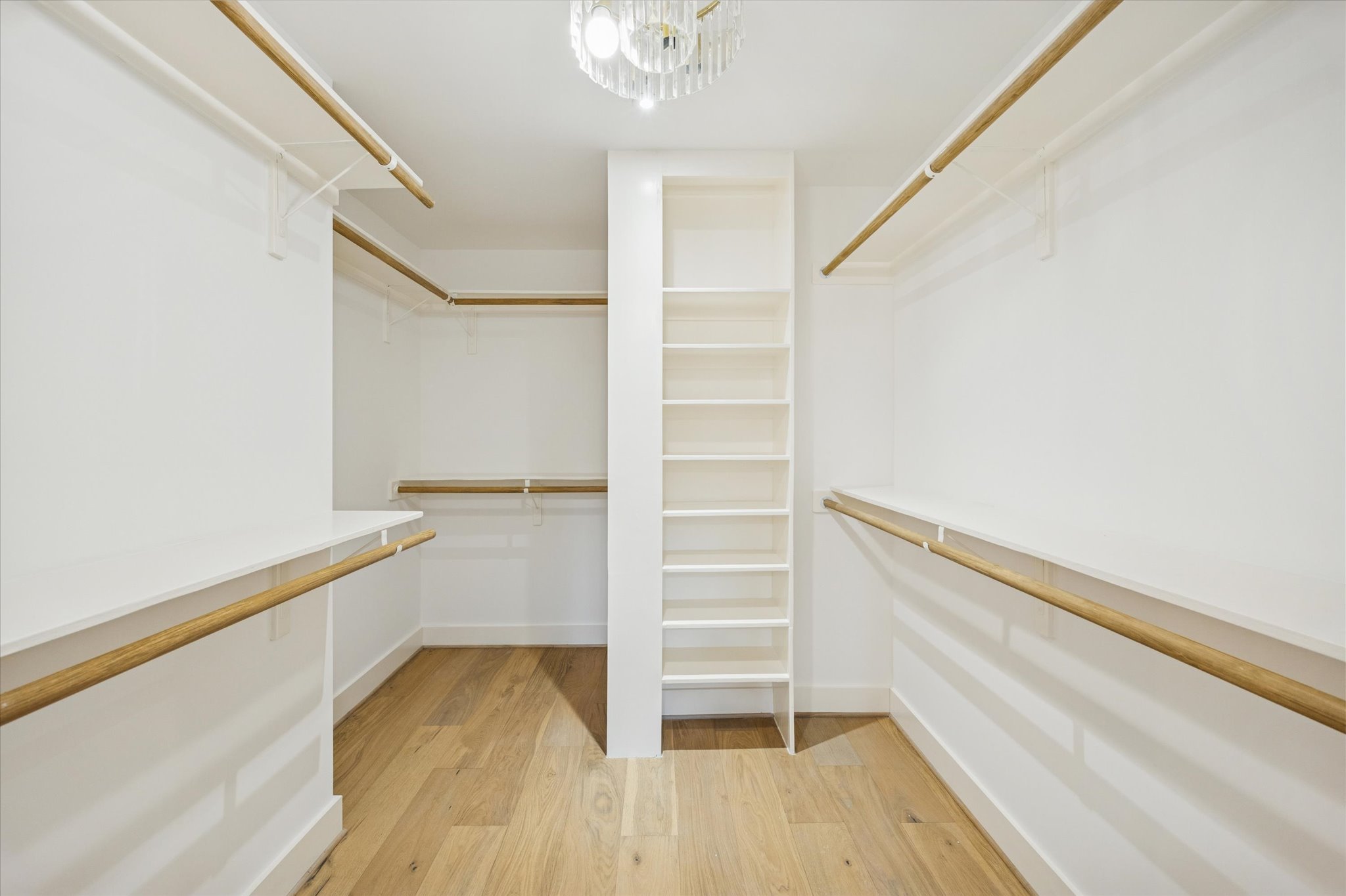 1611 Ridgehaven Drive Austin, TX 78723 - Photo 21 of 35 a view of walk in closet with empty racks