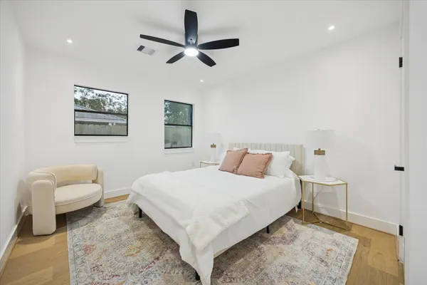 a bedroom with a bed and a couch