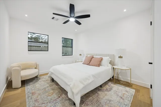 a bedroom with a bed and a couch