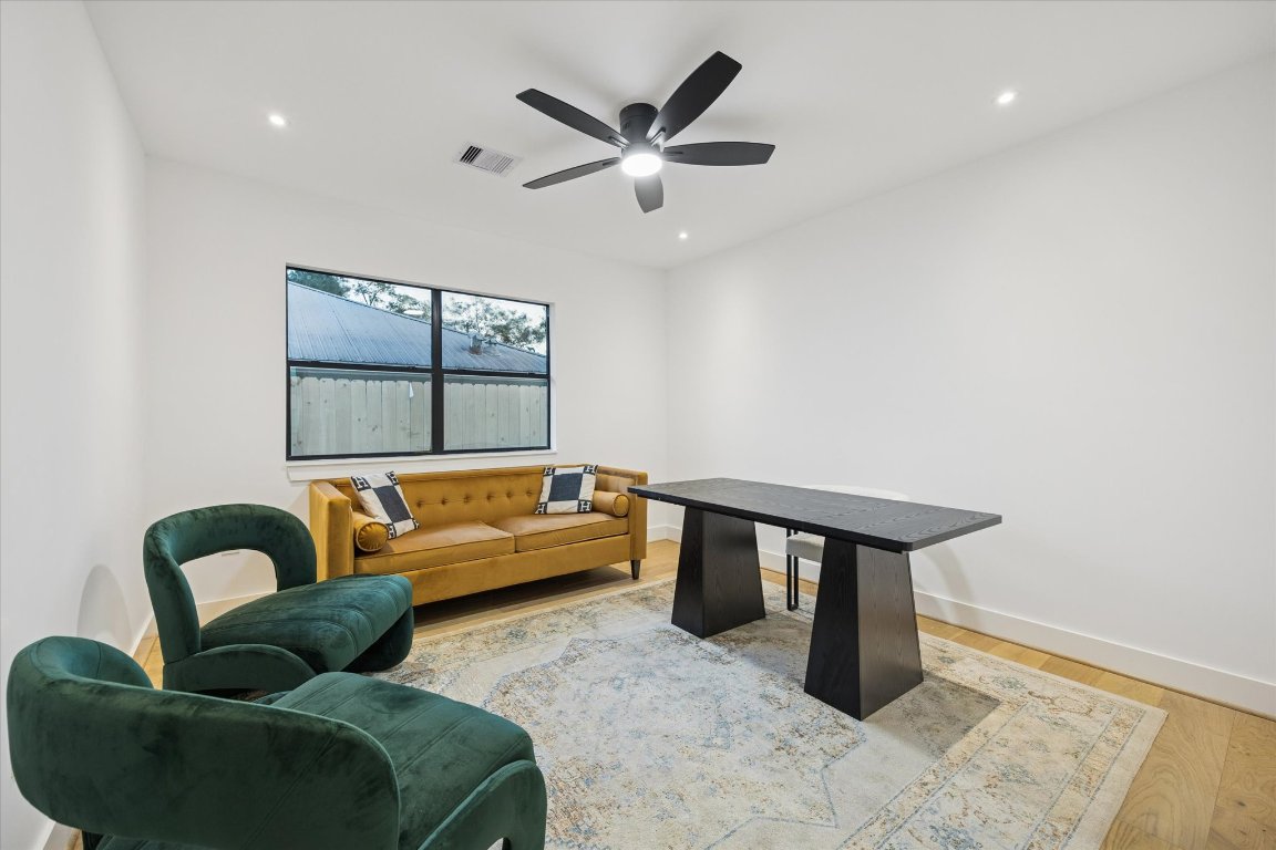1611 Ridgehaven Drive Austin, TX 78723 - Photo 27 of 35 a living room with furniture and a window