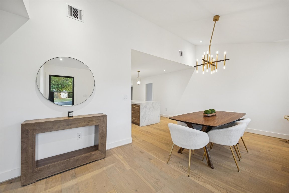 1611 Ridgehaven Drive Austin, TX 78723 - Photo 3 of 35 a workspace with furniture and mirror