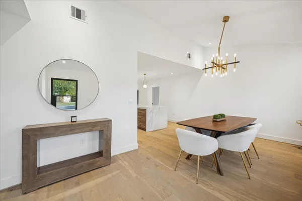 a workspace with furniture and mirror