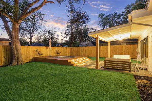 a view of a backyard with a small pool